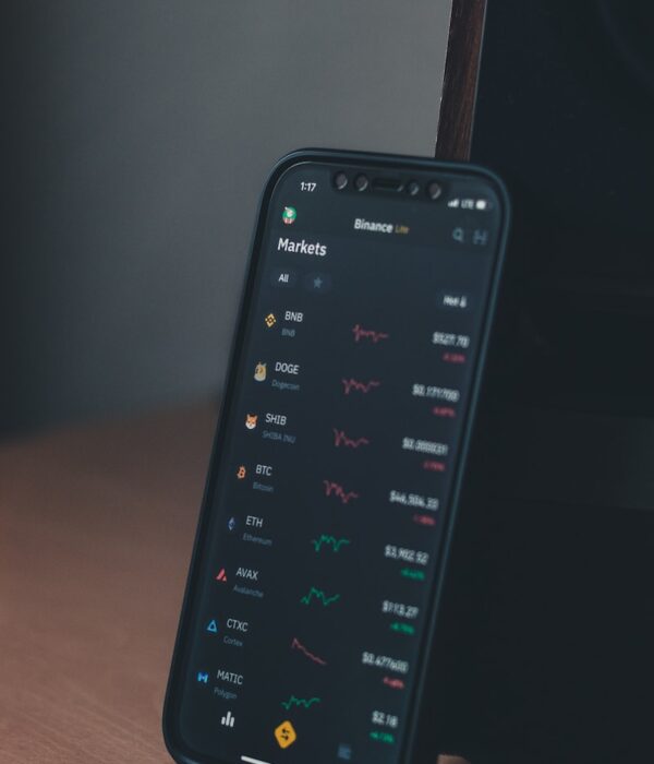 a cell phone sitting on top of a wooden table